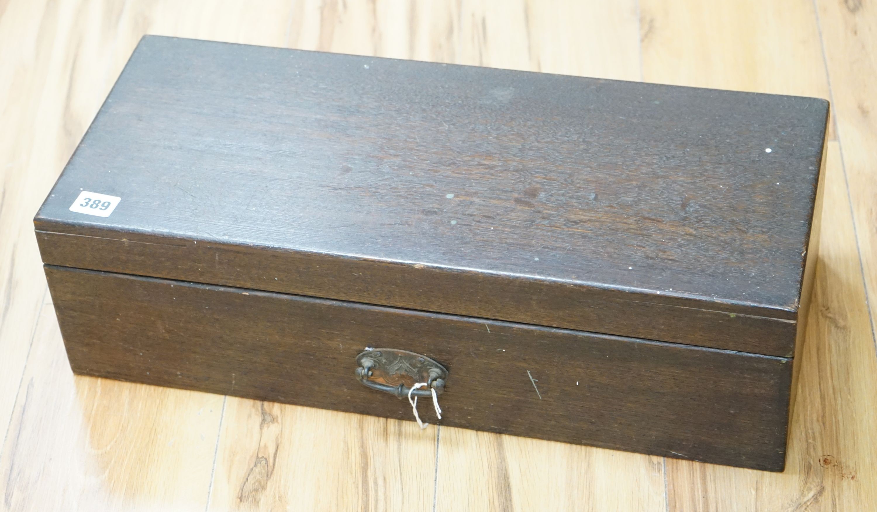 A 19th century oak box with embossed Art Nouveau copper handle, length 53cm